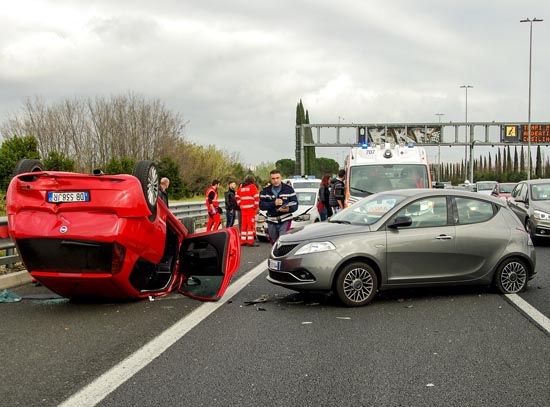 Picture of an accident scene with car turned over